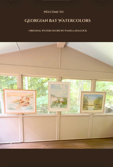 Georgian Bay Watercolors outdoor gallery featuring original watercolor paintings by Pamela Hallock displayed on a bright, sunlit porch in natural light.