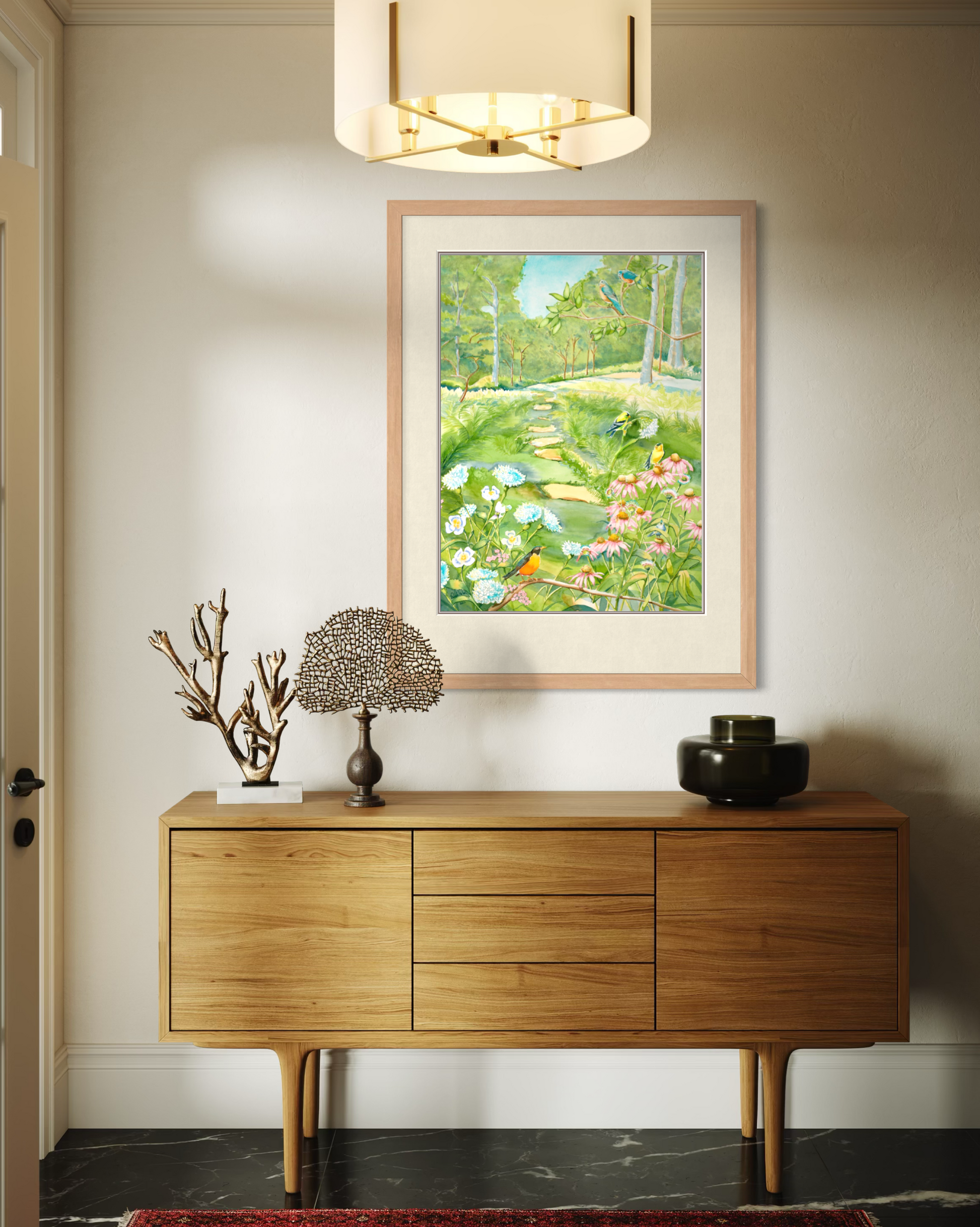 Midwest Garden watercolor print by Pamela Hallock framed above a modern wood console in a bright neutral interior.