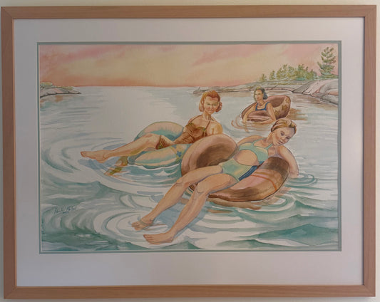 Framed original watercolor painting, Pink Skies, by Pamela Hallock featuring three women relaxing in inner tubes on the calm waters of Georgian Bay beneath a soft pink evening sky.