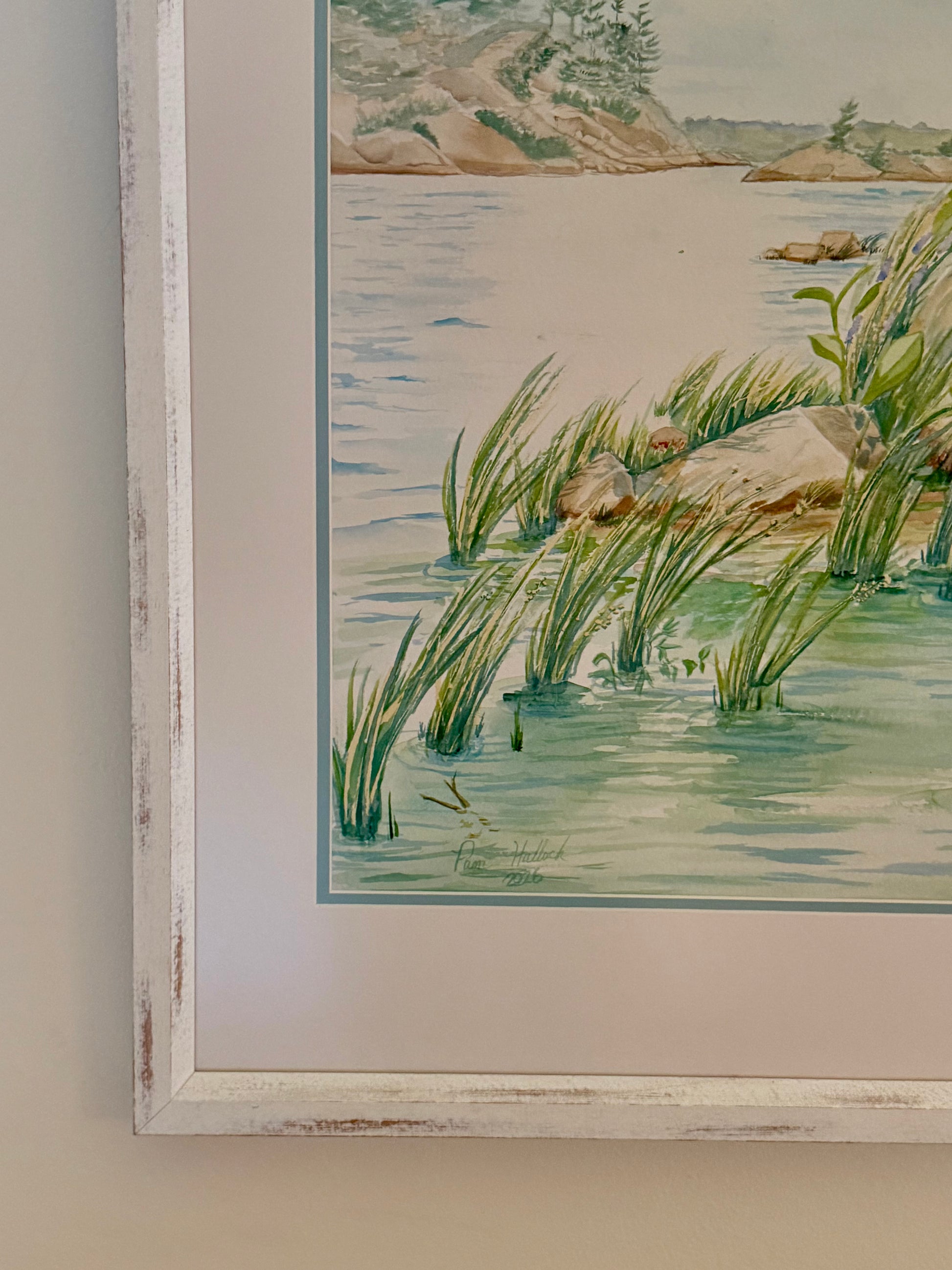 Close-up detail of the original framed watercolor "Granite and Wind" by Pamela Hallock, featuring the artist's signature, textured distressed frame, archival matting, and professional presentation.