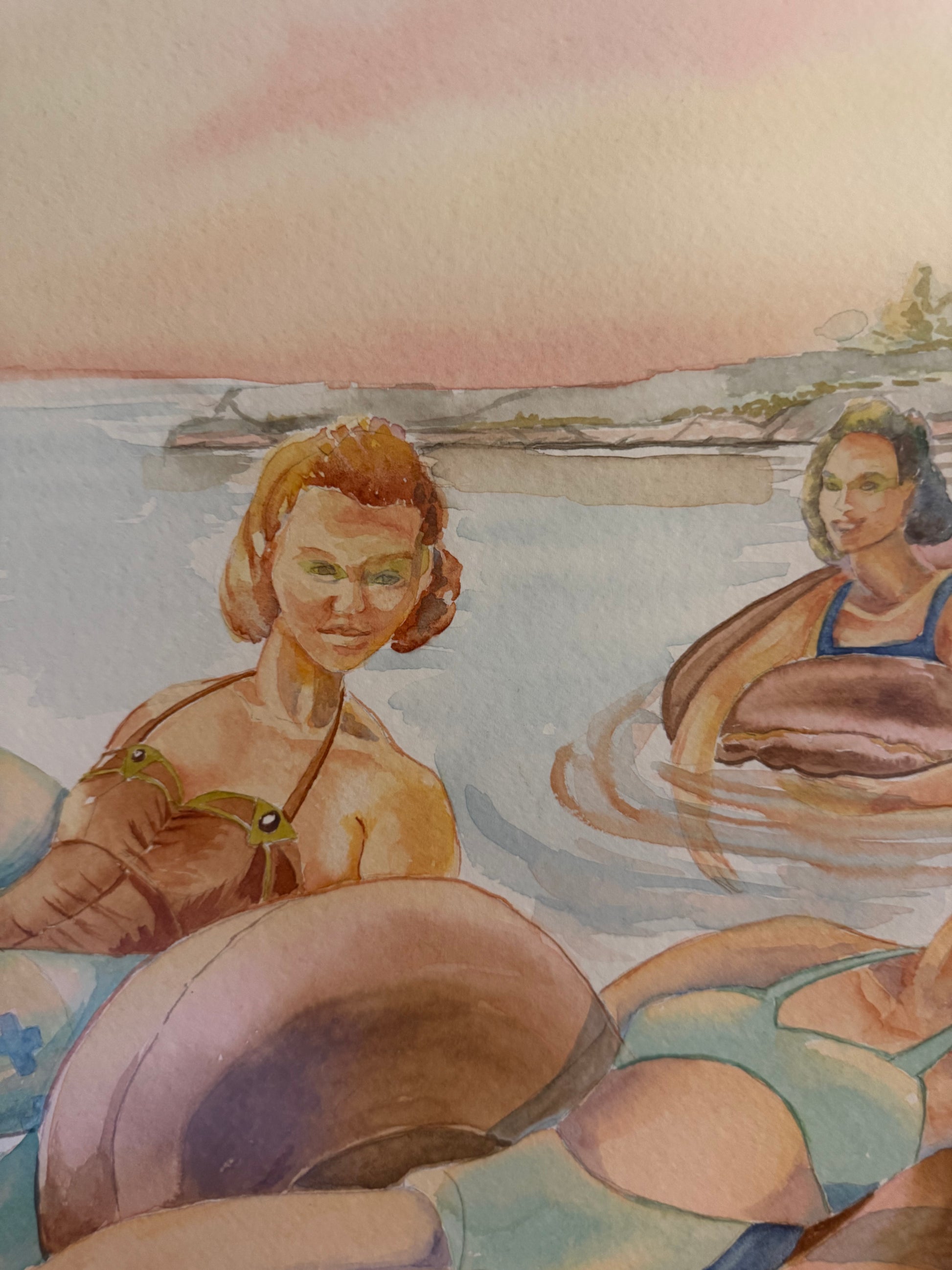 Close-up detail of "Pink Skies" by Pamela Hallock, showcasing transparent watercolor washes, gentle water reflections, and three women enjoying a peaceful evening on Georgian Bay.