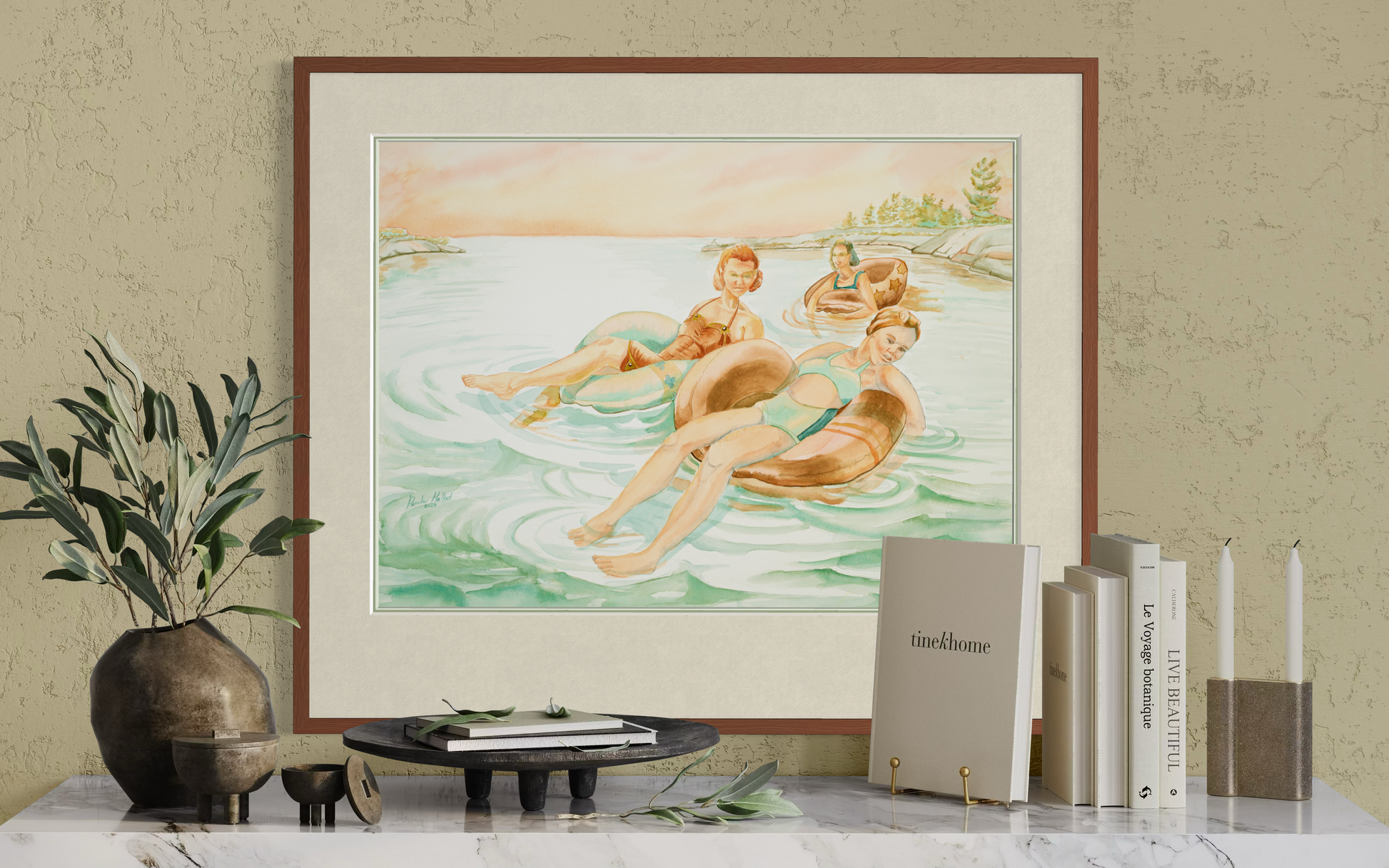 Pink Skies watercolor wall art in a minimalist room setting above a shelf