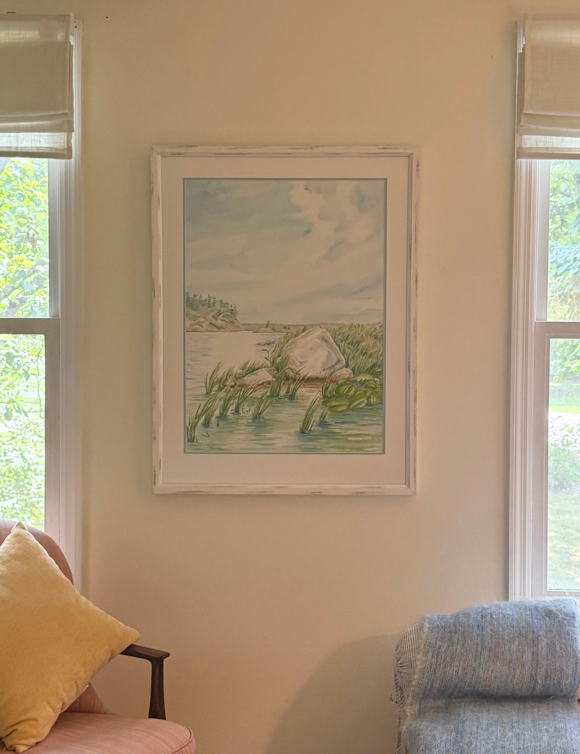 Original framed watercolor "Granite and Wind" by Pamela Hallock displayed in a home interior. Inspired by the rugged shoreline of Georgian Bay, Ontario, and photographed in natural light.