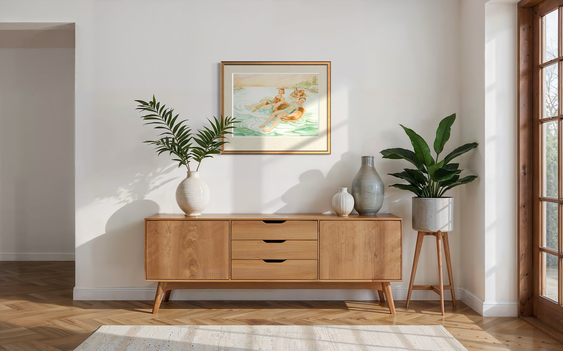 Pink Skies watercolor print in a bright room with natural light and greenery setting