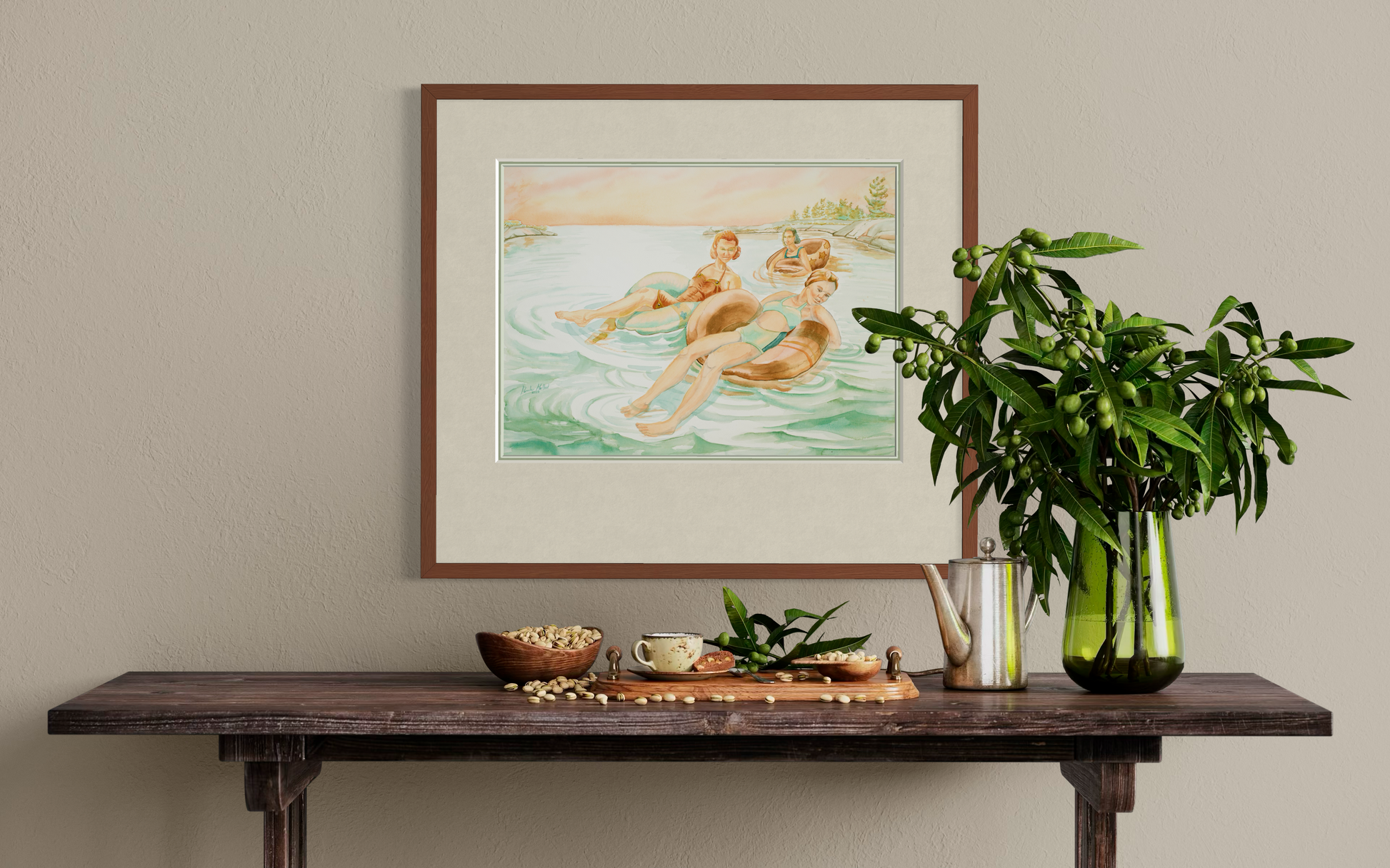 Georgian Bay watercolor print Pink Skies displayed on a wall above a wooden shelf