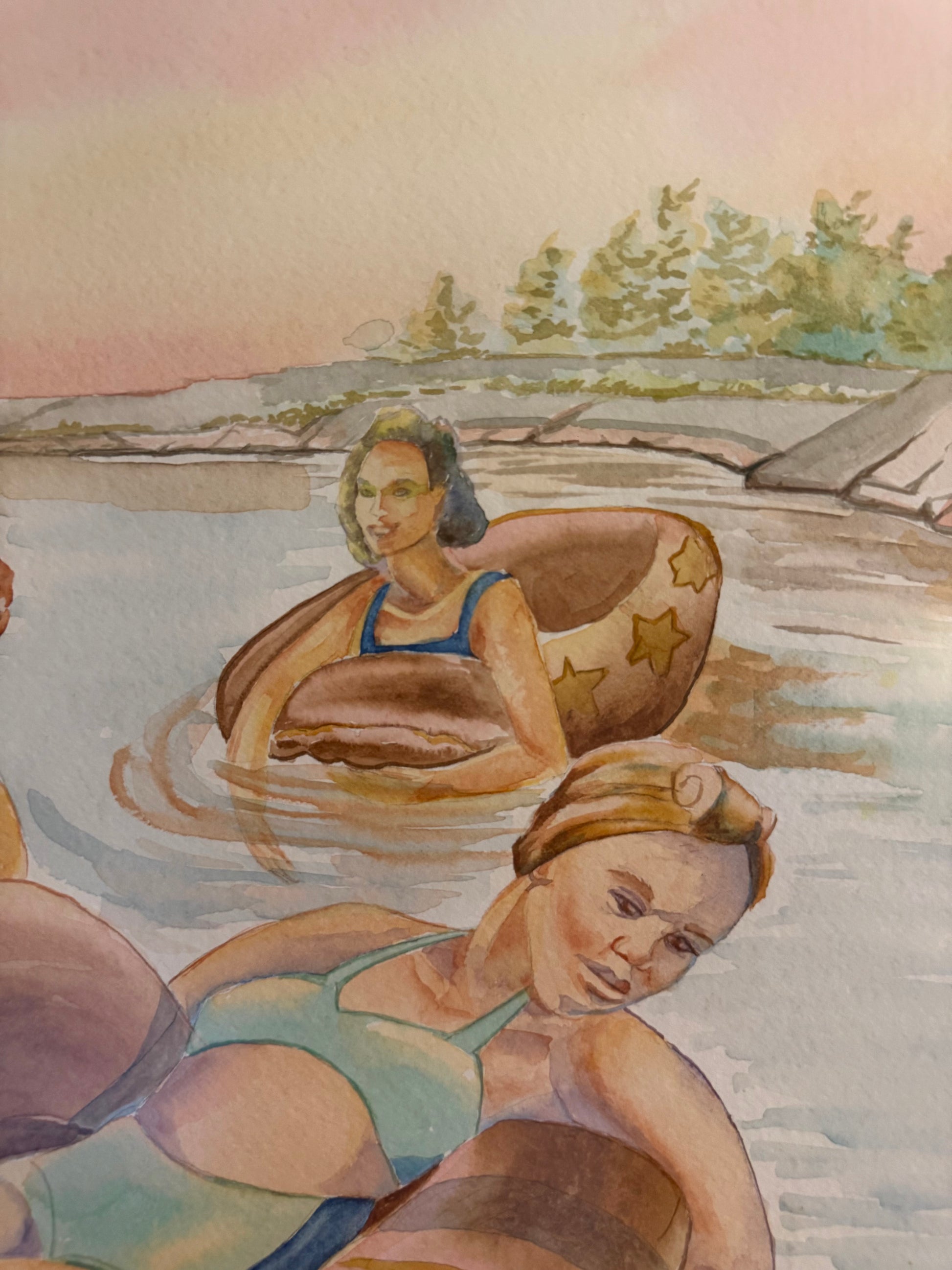 Close-up detail of "Pink Skies" by Pamela Hallock, showcasing transparent watercolor washes, gentle water reflections, and three women enjoying a peaceful evening on Georgian Bay.