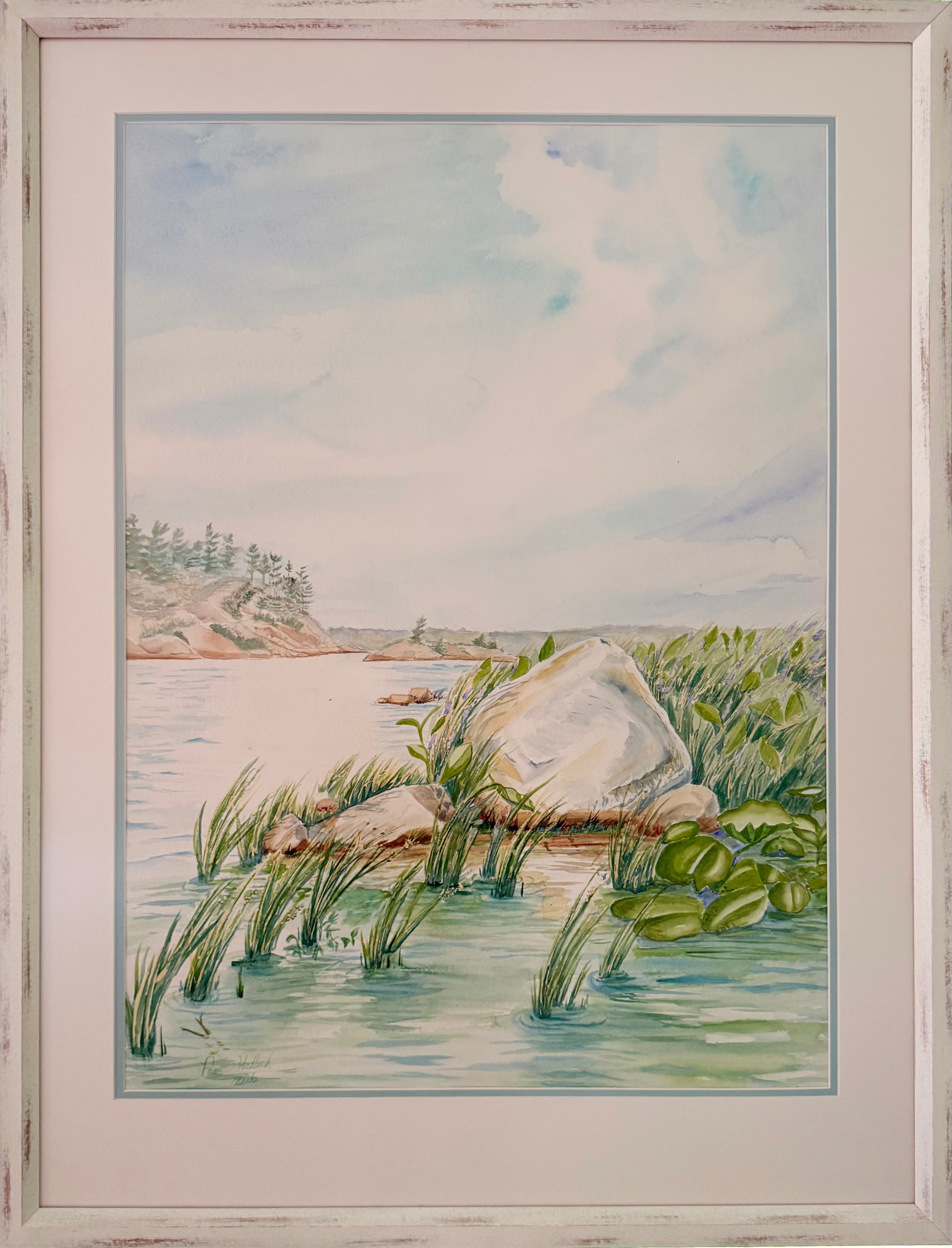 Granite and Wind original framed watercolor painting depicting a Georgian Bay shoreline with granite rock, reeds, calm water, and soft northern sky by Pamela Hallock.